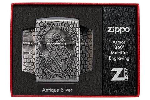 Zippo Armor® Feuerzeug Frontansicht in chrom antik mit Sankt Christopherus Abbildung tief eingraviert in ovaler Form umgeben von Wabenmuster in offener luxuriöser Box