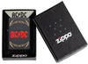 Zippo Feuerzeug AC/DC® Frontansicht mit Titel des ersten Albums und Rock and Roll Slogan umgeben von Blitzen mit AC/DC® Logo in der Mitte in rot auf schwarzem Hintergrund in offener AC/DC® Verpackung